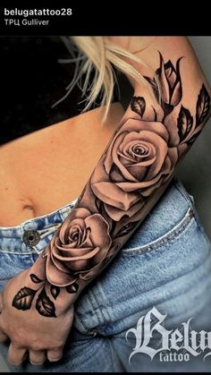 a woman's arm with roses on it