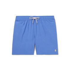 Polo Ralph Lauren's 'Traveler' swim shorts are cut in a comfortable mid-length shape, so you can be active in them on the beach. They're made from moisture-wicking stretch recycled-shell and lined in lightweight mesh. Casual Fitted Swim Trunks With Upf 50+, Casual Stretch Swim Trunks For Pool, Sporty Swim Trunks For Pool And Warm Weather, Summer Go-dry Swim Trunks For Poolside, Summer Poolside Go-dry Swim Trunks, Casual Stretch Shorts For Pool, Blue Go-dry Swimwear For Beach Season, Athleisure Solid Color Swim Trunks For Summer, Casual Nylon Athletic Shorts For Beach Season