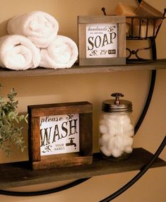 two shelves with towels and soaps on them