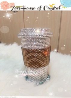 a crystal candle holder sitting on top of a white fur covered floor