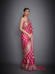 Editor's Note This set features a fuchsia floral/tropical saree with an unstitched blouse. Fabric: Silk Satin Components: Sari and unstitched blouse Care: Dry Clean Only About the DesignerRi Ritu Kumar is one of India’s foremost designers. She has developed a unique style of her own, reflecting the ancient traditions of Indian craftsmanship in a contemporary vocabulary. With a background in art history and museology, which has enriched her horizons, Ritu’s understanding of ancient designs and th Transitional Pink Banarasi Silk Pre-draped Saree, Transitional Season Pink Banarasi Silk Pre-draped Saree, Traditional Pink Blouse With Dupatta, Pink Sharara With Zari Weaving, Pink Unstitched Festive Blouse Piece, Unstitched Pink Blouse Piece For Festive Occasions, Pink Unstitched Blouse Piece For Festive Season, Pink Zari Weaving Unstitched Sets, Pink Unstitched Zari Weaving Sets