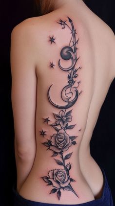 the back of a woman's tattoo with roses and stars