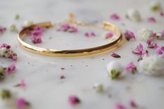 The Lola Cuff is oh so classic with a touch of sparkle! It’s perfect to wear to work, or your next date night. FEATURES 16K gold, rose gold or rhodium over brass base (tarnish resistant) cuff 14K gold-filled or sterling silver chain extender, adjustable length Tiny cubic zirconia stone All bracelet findings (clasp, chain, jump rings) are all gold-filled/sterling silver to ensure the highest quality piece. Rose Gold Cuff Bracelet, Gold Bracelet Simple, Gold Bracelet Cuff, Gold Cuffs, Chain Extenders, Minimalist Bracelet, Gold Bangle Bracelet, Wear To Work, Silver Cuff Bracelet