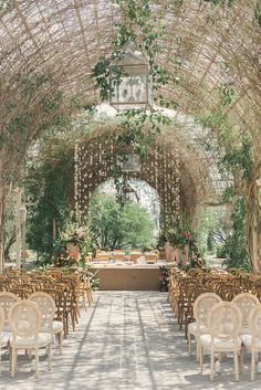 an outdoor wedding venue with tables and chairs