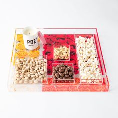 an assortment of nuts and other food items on a tray