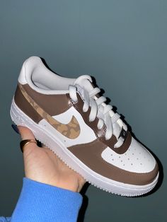 Hand-painted Air Force 1 sneaker with A cow print swoosh and various shades Of brown.  * comes in different colors (i.e. various shades of pink or blue), message me if you would prefer different colors besides brown Nike Custom Tan Airforce, Brown And Blue Nike Shoes Trendy, Nike Air Force 1 Cow Print, Colorblock Nike Air Force 1, Nike Air Force 1 Cheetah, Nike Air Force 1 Custom Elephant, Painted Air Force 1, Air Force 1 Shoes, Custom Af1