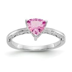 a white gold ring with a pink heart shaped stone