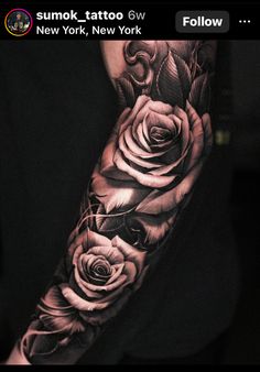 an arm tattoo with roses on it