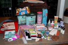 the contents of a purse are laid out on the kitchen counter, ready to be packed