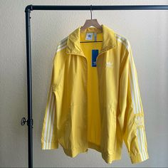 Men’s Yellow Windbreaker. New, With Tags. Adidas Yellow Outerwear For Streetwear, Adidas Yellow Long Sleeve Outerwear, Yellow Long Sleeve Sportswear Outerwear, Adidas Urban Spring Track Jacket, Grunge Outfits Men, Adidas Shirt Mens, Yellow Windbreaker, Vintage Windbreaker Jacket, Yellow Adidas