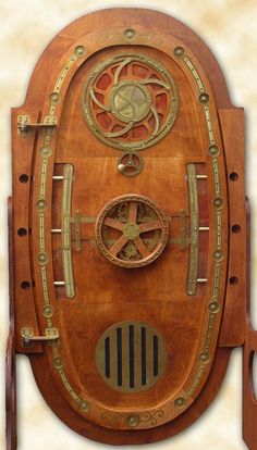 an old fashioned wooden clock with gears and dials