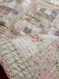 an old quilt is laying on the bed