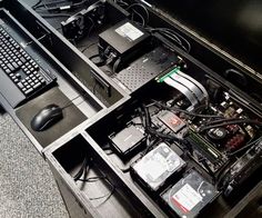 an open laptop computer sitting on top of a desk next to a keyboard and mouse