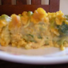 a white plate topped with broccoli and cheese