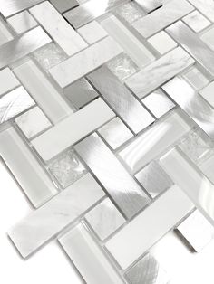 white and silver glass tile with metal strips