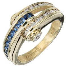 Authentic Charles Krypell sapphire and diamond ring. 10 round cut sapphires and 26 full cut diamonds set in 18k yellow gold split shank band ring. 10 round fine blue Sapphires approx. total weight .30cts 26 full round cut diamonds approx. total weight .60cts, G-H, VS1-SI1 Size 6.25 and sizable 18k Yellow Gold 7.3 grams Stamped: 18k © Krypell Width at top: 10mm Width at bottom: 3mm Height at top: 7mm Multi-stone Sapphire Ring In Yellow Gold, Luxury Yellow Gold Sapphire Ring With Single Cut Diamonds, Yellow Gold Sapphire Ring With Channel Set Diamond, Yellow Gold Multi-stone Sapphire Ring, Gold Sapphire Ring, Channel Set Fine Jewelry, Luxury Yellow Gold Sapphire Ring Channel Set, Fine Jewelry Sapphire Ring With Channel Set, Gold Sapphire Ring Channel Set Fine Jewelry, Fine Jewelry Round Sapphire Ring With Channel Set