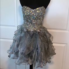 Worn Once For Homecoming - Beautiful Dress Size Women’s Small Rhinestones On The Lined Top & Ruffles On The Lined Bottom Steel Gray Color It Does Come With Shoulder Straps (Never Used) And A Band That I Think Goes Around The Waistline?? Never Used That Either. Please Check Measurements For Fit. 13” Side Zipper, 25” From Armpit To Bottom Of Dress, 13.5” From Side To Side At The Waist. Stored In A Garment Bag. Beautiful Dress. Rhinestone Dress For Homecoming Party Season, Rhinestone Homecoming Dress For Party Season, Homecoming Dresses With Rhinestones For Party Season, Hoco Dress, Rhinestone Fashion, Garment Bag, Hoco Dresses, Party Dresses For Women, Beautiful Dress