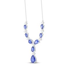 This elegant necklace for her showcases an alternating design comprised of pear-shaped blue lab-created sapphires and sparkling round white lab-created sapphires. The 16.65-inch sterling silver necklace features a box chain that secures with a lobster clasp. Blue Pear-shaped Necklace For Formal Occasions, Formal Silver Necklace With Lab-created Sapphire, Blue Lab-created Sapphire Necklace For Anniversary, Blue Pear-shaped Diamond Necklace, Classic Blue Pear-shaped Necklace, Exquisite Silver Sapphire Necklace, Luxury Silver Necklace With Lab-created Sapphire, Heart-shaped Sapphire Necklace In Sterling Silver, Blue Pear-shaped Cubic Zirconia Necklace