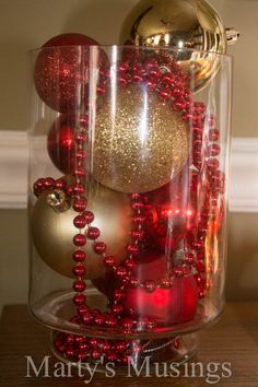 red and gold ornaments in a glass container