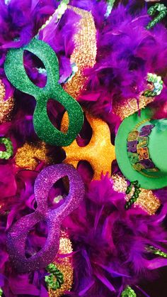 mardi gras decorations with purple and green feathers