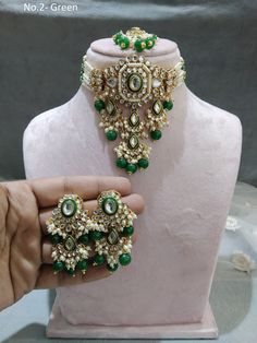 *Light Weight kundan choker necklace set. *Beautiful & Light in weight. *Necklace width: 3.7 inches (included drops) *Earrings length: 2.5 inches  (with drops)   *Earrings width size-: 1.2 inches Green Kundan Choker For Celebration, Green Kundan Choker Necklace For Diwali, Green Chandbali Choker For Diwali, Diwali Green Chandbali Choker, Green Choker For Diwali Party, Green Choker For Diwali Celebration, Diwali Celebration Green Choker, Green Kundan Choker Necklace Bollywood Style, Festive Green Kundan Choker Necklace