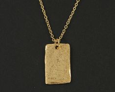 Simple gold rectangle necklace featuring a textured gold pendant. The edges are not entirely smooth and they have a distressed texture that make them look like relics from long ago. Charms are manufactured in the US and are made of pewter that meet CPSIA standards. Charms are 3/4 inches tall and 1/2 inches wide (1.9 x 1.3 cm). Your choice of necklace length - 18 or 20 inches. Thank you for stopping by! Find more handmade necklaces here - https://www.etsy.com/shop/BeautifulByCharlene?section_id=13383312 Enter my shop here - https://www.etsy.com/shop/BeautifulByCharlene Rectangle Necklace, Distressed Texture, Minimalist Contemporary, Rustic Jewelry, Modern Necklaces, Geometric Pendant, Gold Geometric, Simple Necklace, Gold Texture