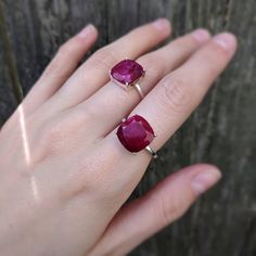 ---------------------------------------- THE PRODUCT Raw ruby ring. This is a handcrafted genuine and natural large raw ruby gemstone ring. We make it from high quality natural rubies that have a bright red color and is apx. 5 cts. The stone is tablet cut to show off all it's colors and beautiful imperfections and make for a unique look. Each stone has different markings and tones reminding you that not only is this truly a piece of the earth but it is one of a kind and yours is completely uniqu Square Cut Ruby Ring In Red, Rectangular Red Ruby Ring, Square Cut Red Ruby Ring Gift, Red Square Cut Ruby Ring Gift, Red Square Cut Ruby Ring, Square Cut Ruby Ring, Handmade Ruby Ring, Raw Ruby, Natural Ruby Ring