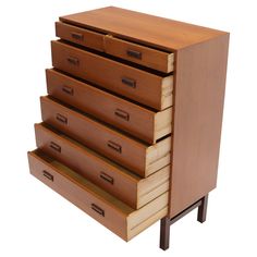 a wooden dresser with five drawers on it