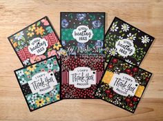 five handmade thank you cards with floral designs on the front and back, sitting on a wooden surface