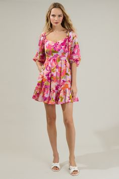 Wear the Abigal Floral Evy Sweetheart Mini Dress with your favorite heels and get ready for a day of fun! It features a sweetheart neckline, framed by voluminous puff sleeves. It maintains a babydoll fit with a high waist and a flared skirt with a ruffle hem. The back has a smocked panel, making it easy to slip on and off. Add on a matching purse to complete your outfit! - Smocked back- Princess seams- Pocket- Bubble sleeves- Color: Coral MultiSize + Fit - Model is 5'8" and wearing size XS- Meas Feminine Mini Dress With Heart-shaped Neckline For Spring, Pink Mini Dress With Sweetheart Neckline For Vacation, Pink Sweetheart Neckline Mini Dress For Vacation, Flowy Mini Dress With Sweetheart Neckline, Spring Mini Dress With Heart-shaped Neckline And Ruffles, Spring Mini Dress With Ruffles And Heart-shaped Neckline, Spring Brunch Dress With Heart-shaped Neckline, Pink Flowy Mini Dress With Sweetheart Neckline, Flowy Floral Mini Dress With Sweetheart Neckline