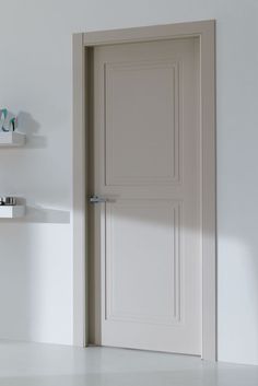 an open door in a white room with shelves