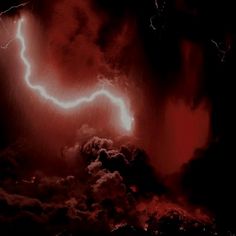 a lightning bolt is seen in the sky above some clouds and lava, with red lightening behind it