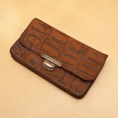 "Vintage real leather wallet . The wallet has multiple sections. It is in dark brown colour and has brick stone design. The wallet is about 6 cm tall, 11 cm wide and 1.5 cm thick when closed and filled with few things. The item weights 60 g. We also have similar products in our shop. Please take a look. https://www.etsy.com/uk/shop/UKAmobile Please read the shipping policies, before you purchase this item. Thank you! ART.ATK.x19 21/09/2021Please note we sell vintage and antique items, the most of them are unique and just one of that kind. You will receive the same item you can see in the photos. Rarely, there is note:\" The items in the pictures may be slightly different from the actual items\". This note means that we have had several items of the same kind and the only difference could b Rectangular Vintage Brown Wallet For Daily Use, Vintage Brown Rectangular Wallet For Daily Use, Vintage Brown Rectangular Wallets For Daily Use, Vintage Brown Wallet With Card Slots, Vintage Brown Wallet With Interior Card Slots, Brown Rectangular Coin Purse With Card Slots, Brown Rectangular Wallet With Interior Card Slots, Brown Rectangular Coin Purse With Interior Card Slots, Brown Rectangular Wallet