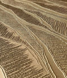 an aerial view of sand dunes in the desert