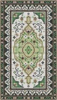 a green and white rug with an ornate design on it's border, in the middle