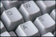 a computer keyboard with the letters q and w on it