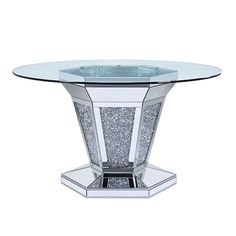 a glass table with silver glitters on the top and bottom, in front of a white background