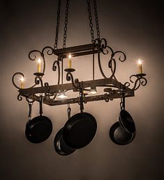 a chandelier with pots and pans hanging from it