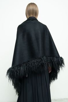 100% cashmere/ black fur/ black fringe Length: 30" x 73" including fur and fringe trim Chic Black Sheepskin Fur Coat, Elegant Black Sheepskin Fur Coat, Chic Black Fur Coat With Feather Trim, Black Fringed Outerwear For Winter, Black Fringe Outerwear For Winter, Black Winter Outerwear With Tassels, Black Tasseled Outerwear For Winter, Fall Evening Fur Coat With Feather Trim, Black Faux Fur Evening Coat