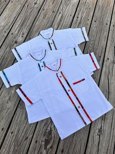 Our guayaberas for children are a must have. They are perfect for any occasion including but not limited to: *Picture sessions *Weddings *Graduations *Vacation *Everyday Use *Strip colors may be different colors than pictures* - Made in Mexico - Pattern Varies on the stripes, You get a one of a kind unique shirt. White Short Sleeve Shirt For Festival, Mexico Pattern, Mexican Party, Unique Shirt, Party Shirts, Kids Tops, Button Up Shirt, Up Shirt, Must Haves