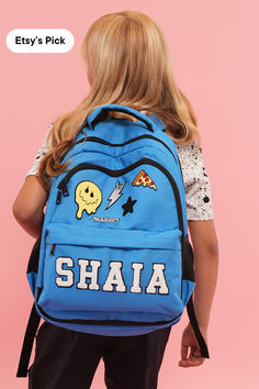 a girl with a backpack Trendy Blue Backpack For Outdoor Activities, Trendy Backpack For School Events, Blue College Backpack For Back To School, Blue Backpack For College And Back To School, Back To School Blue Backpack With Water Bottle Pocket, College Backpack For End Of School Year, Standard Backpack For College And End Of School Year, Blue School Backpack With Water Bottle Pocket, Functional College Backpack For Back To School