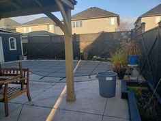 a back yard with an attached patio area