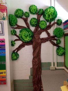 a tree made out of paper on the wall