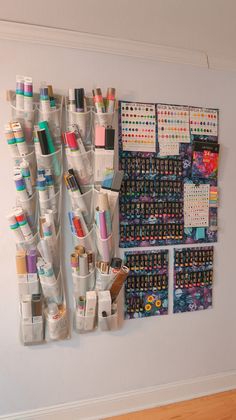 the wall is filled with craft supplies and thread