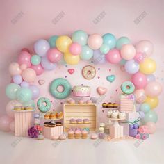 an image of a birthday party with balloons and donuts