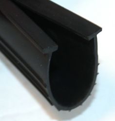 a close up of a black pipe on a white surface