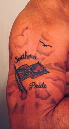 a man with tattoos on his chest and the words southern pride