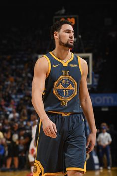 a basketball player standing on top of a court