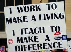 a group of people holding up signs in front of a building with the words i work to make a living, teach to make a difference