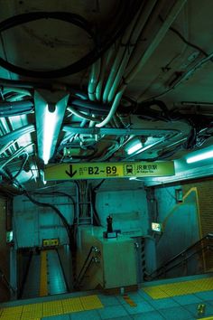 the inside of a subway station with lots of wires